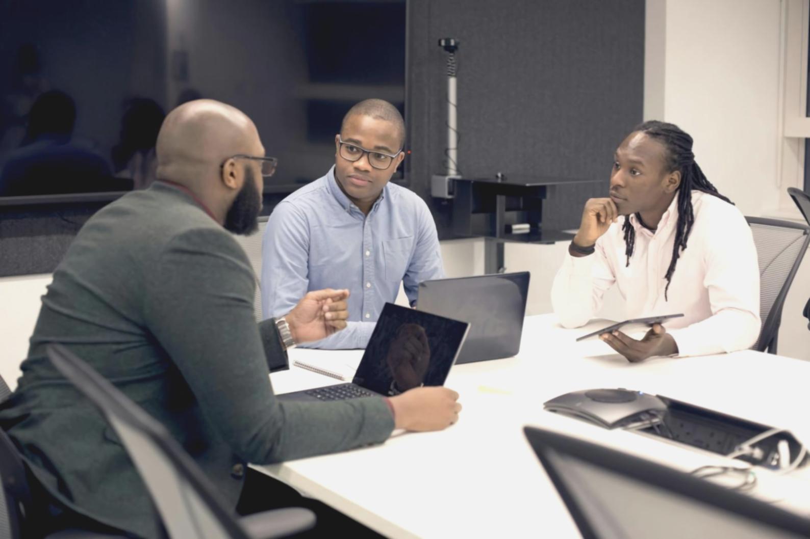 Modern workspace with financial analysis tools, charts, and budget performance reports